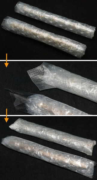 Two pens entombed in packing tape around bubble wrap